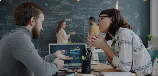 UI/UX designers discussing a digital design